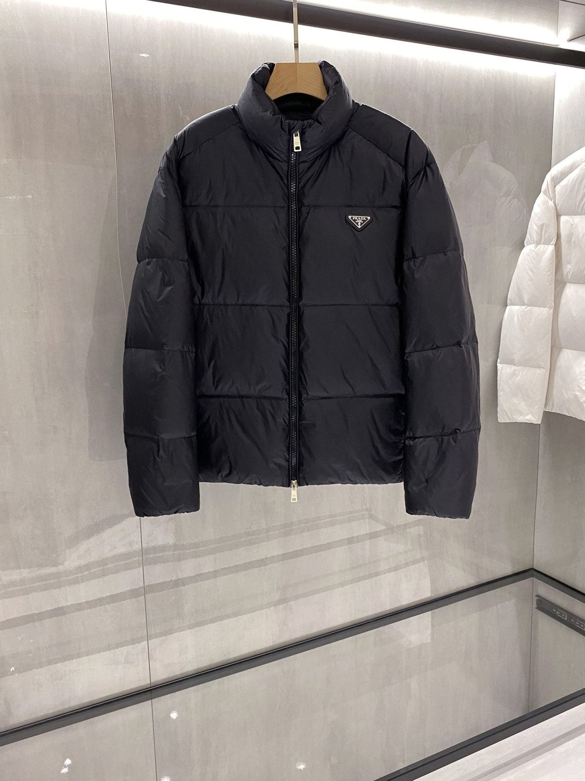 Prada Quilted Triangle Badge Puffer Jacket — front