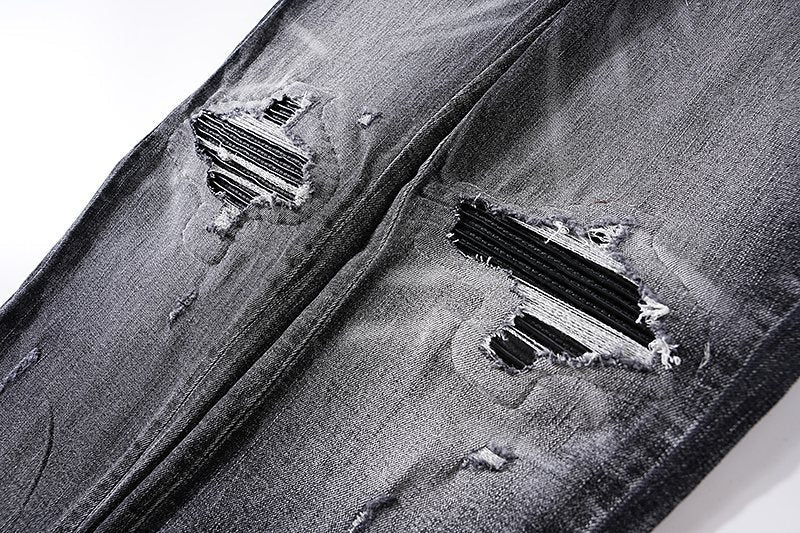 AMIRI Washed Black Distressed Jeans — detail